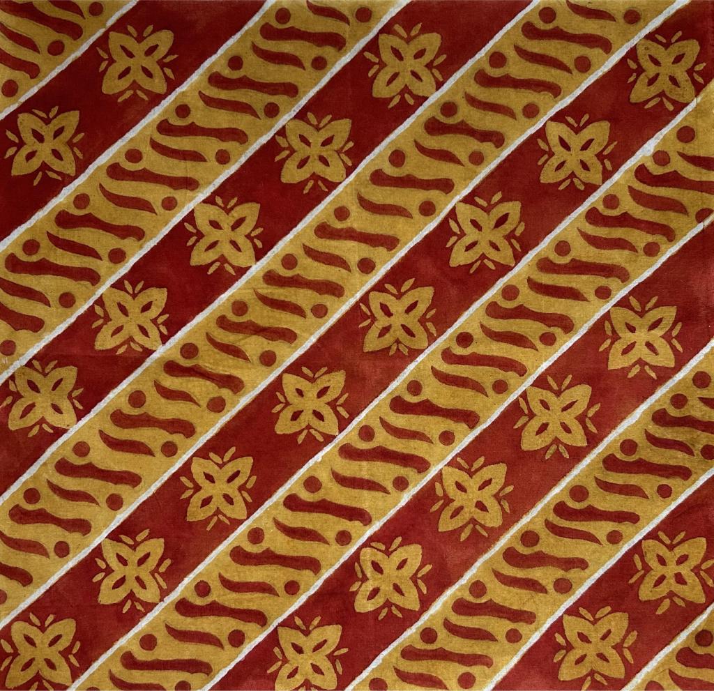 Watercolor abstract painting. Repeating pattern of diagonal stripes separated by thin white lines. The red sections have repeating flower icons painted in gold. The gold sections have repeating curved lines painted in red, accentuated by dots appearing on opposite ends of each curved line.  